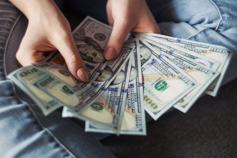 Person Holding 100 US Dollar Bank Notes - From Pexels
